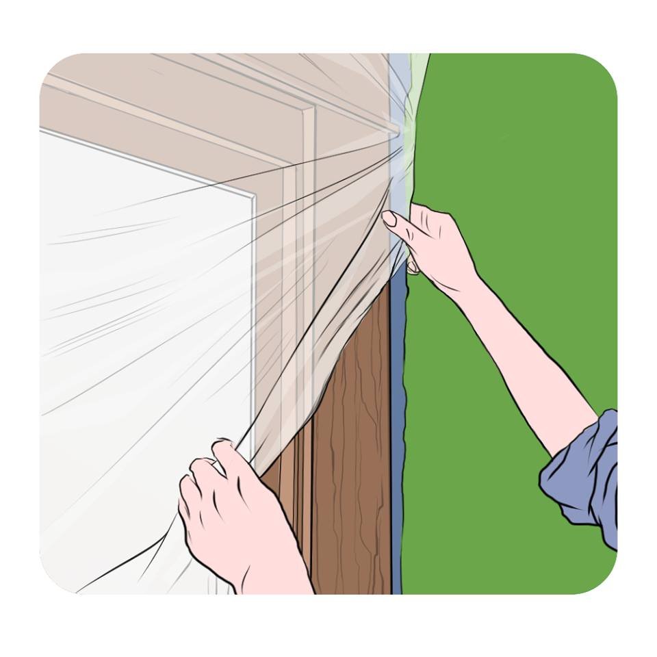 using plastic and wide tape to protect windows and doors