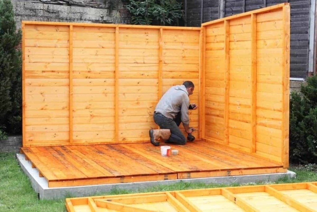 man building a shed