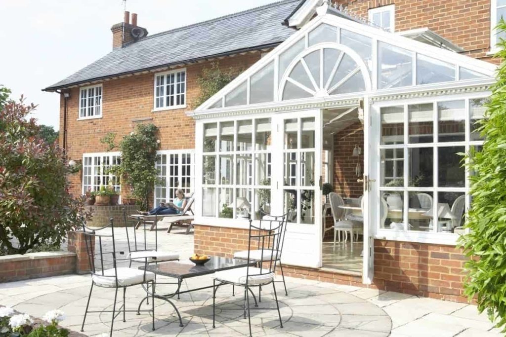 house with conservatory and patio