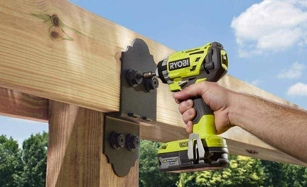 impact driver driving screws into wood