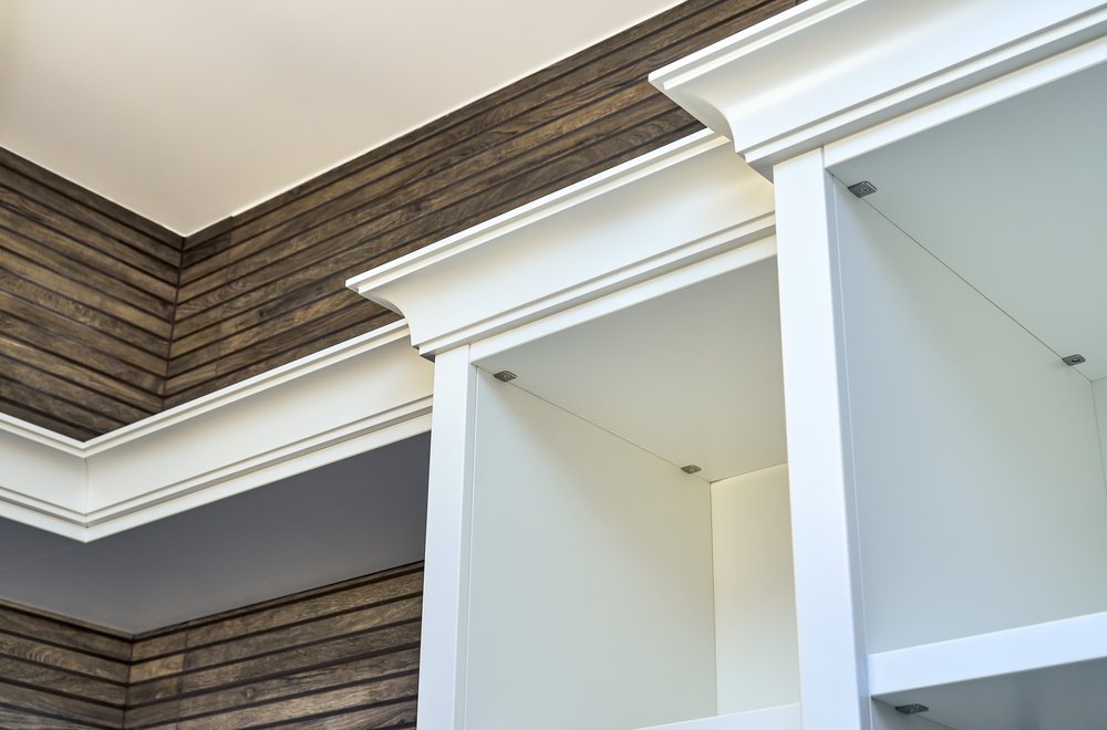 white cornices on cabinet
