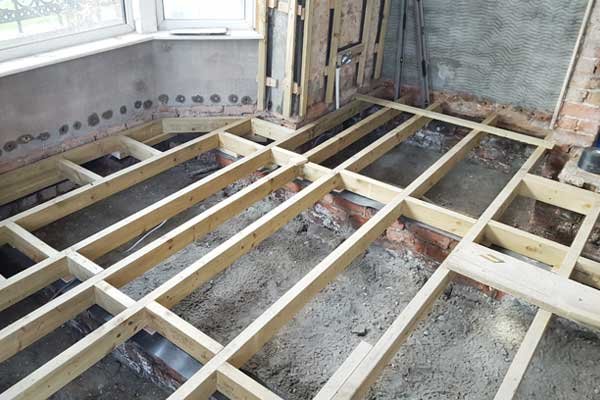 unfinished house floor with suspended timber joists