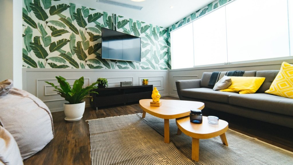 living room with green leaf wallpaper