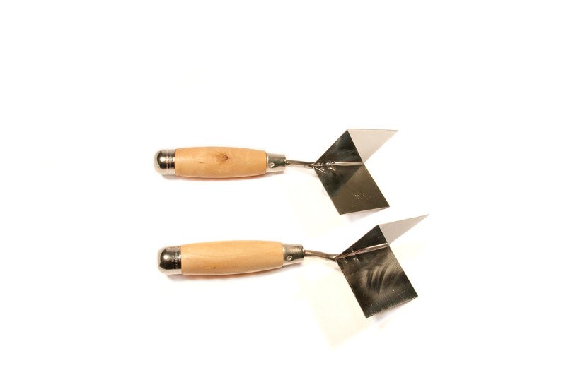 two corner trowel on white background