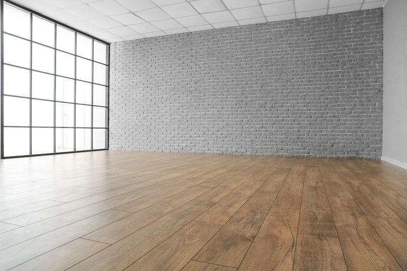 empty room with laminate wood flooring