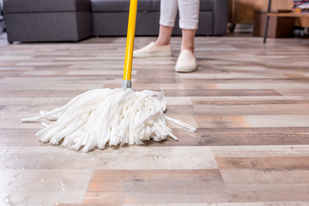 woman mopping laminate flooring