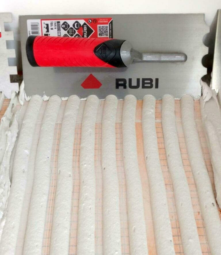 u-notched trowel and curved tile adhesive ridges