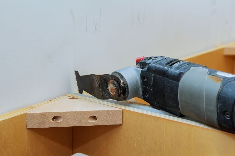 oscillating multi tool over unfinished furniture