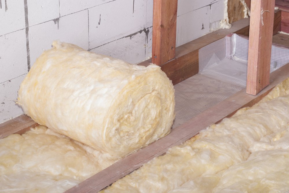 roll of mineral wool insulation in the attic floor